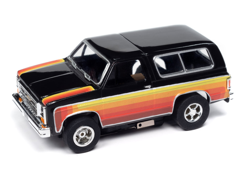 Auto World Xtraction 1979 Chevy Blazer - Black w/ Red & Yellow Side Panels HO Scale Slot Car