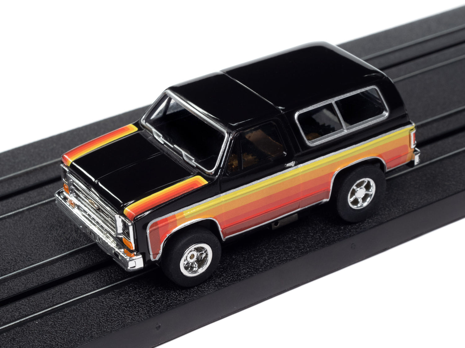 Auto World Xtraction 1979 Chevy Blazer - Black w/ Red & Yellow Side Panels HO Scale Slot Car